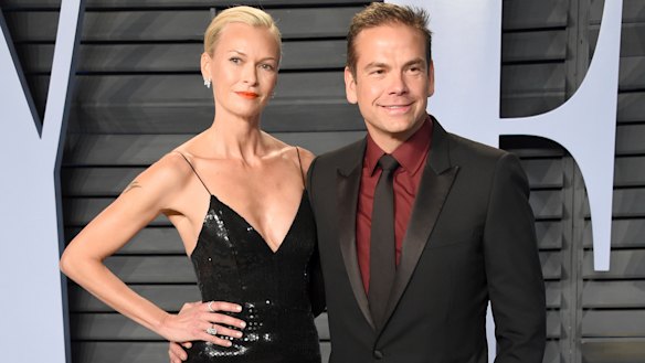 Sarah and Lachlan Murdoch pose at the Vanity Fair Oscars party in Hollywood.