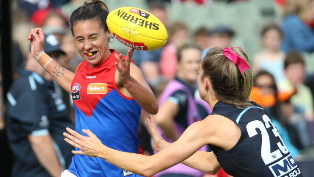 Tipping point: Demon Aliesha Newman comes under pressure from the Blues' Bridie Kennedy.