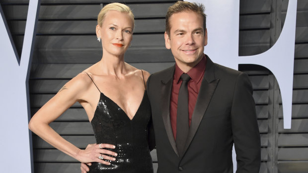 Sarah and Lachlan Murdoch pose at the Vanity Fair Oscars party in Hollywood.