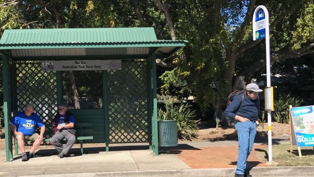 A Moreton Bay Regional Council spokesman said the council had also received complaints about LNP campaigners taking up the shade and bench at a bus stop in Kallangur - leaving commuters with nowhere to sit.