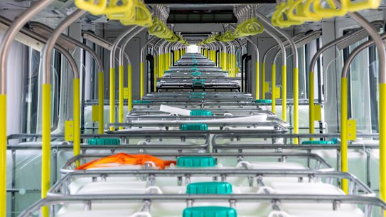 Tanks, each carrying 1000 litres of water, simulate the weight of people on board a Sydney Metro train.