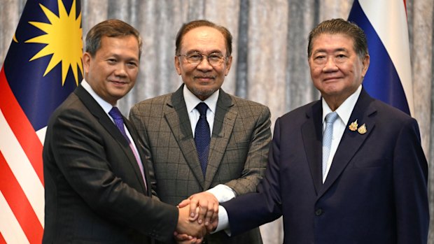 Malaysia’s Prime Minister Anwar Ibrahim (centre) watches on as Cambodia’s Prime Minister Hun Manet left and Thailand’s acting Prime Minister Phumtham Wechayachai  shake hands.