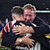 Trent Robinson and Sam Walker embrace after the grand final.