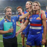 Luke Beveridge and Bailey Smith leave the field after the Bulldogs’ Round 5 win over North Melbourne.