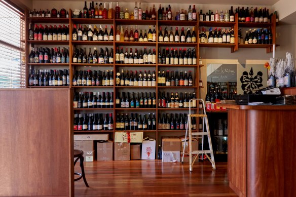 The bottle shop’s wine shelves are well stocked.