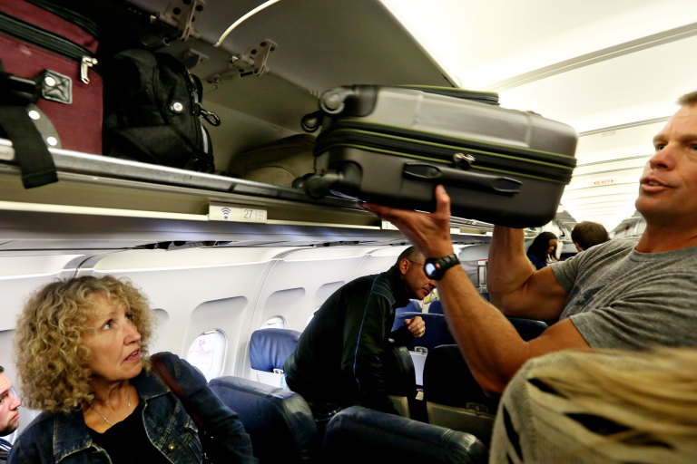 The battle over overhead bin space on planes is getting ridiculous, as more and more passengers try to travel with hand-luggage only.