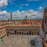 View over Bologna’s Piazza Maggiore, with Garisenda and Asinelli towers in the distance.