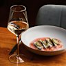 Ginveristy gin-cured fish with fermented tomato and finger lime.