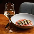 Ginveristy gin-cured fish with fermented tomato and finger lime.