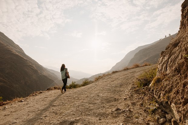 Doris Godoy, a psychologist at Paz y Esperanza (Peace and Hope) in Huánuco, Peru, walks to Xiomara’s home to visit her and her family.