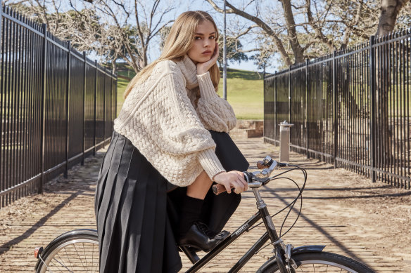 Zimmermann “In Illustration” sweater, $850. Courtney Zheng “Ansel” skirt, $540. Max Mara shoes, $1600 (worn throughout). H&M socks, $20 (worn throughout).