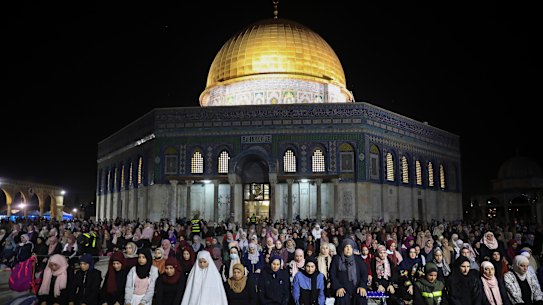 Palestinian Muslim worshippers pray in the holy fasting month of Ramadan, in front of the Dome of the Rock Mosque at the Al Aqsa Mosque compound in Jerusalem’s Old City. 
