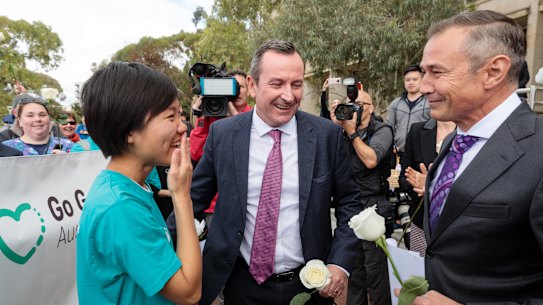 Belinda Teh is greeted by Premier Mark McGowan and Health Minister Roger Cook outside WA Parliament House. The 27-year-old Perth woman embarked on a 4500km journey from Melbourne to Perth after watching her mother die from breast cancer in 2016.