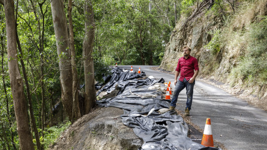 Amaroo Valley Springs owner Andy Cichanowksi inspects the damage on Bunkers Hill Road.