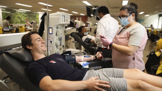More Australians will be able to give blood after changes to eligibility. Marlon Skeldon gives blood in Sydney CBD earlier this month.