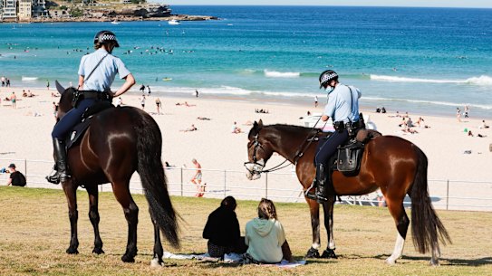 Police patrol Bondi Beach during a COVID lockdown in August 2021.