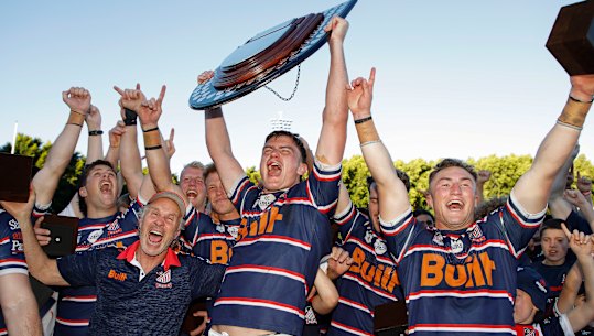 Easts captain Josh Bokser and the team celebrate with the Shute Shield.