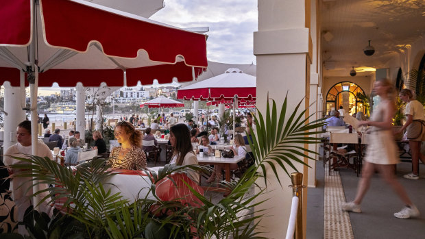 Promenade Bondi’s indoor-outdoor ocean-facing terrace features red-and-white umbrellas.