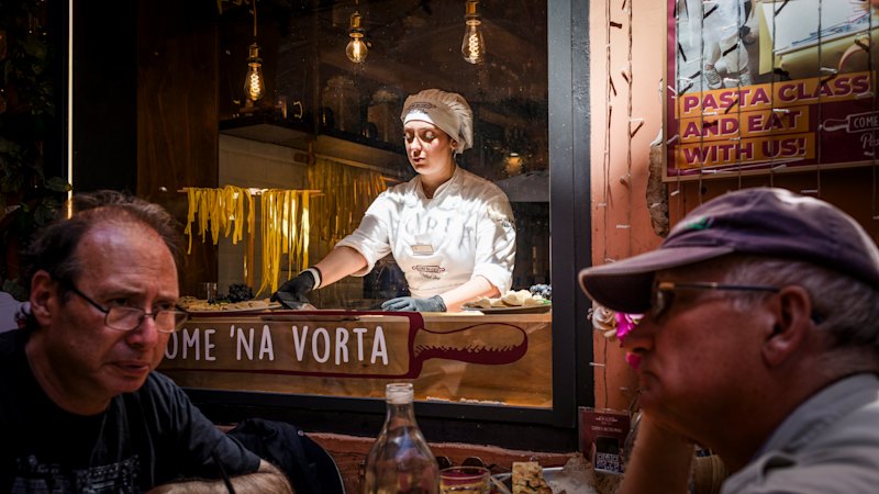 Window display pasta-making “nonnas” draw tourists in Rome, with locals criticizing