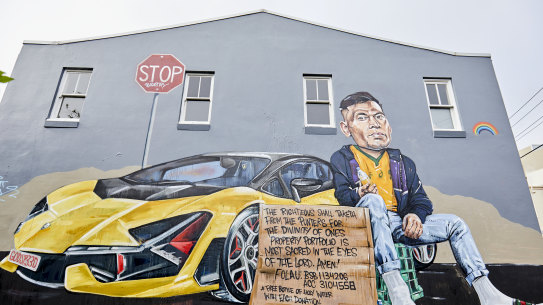 The mural of Israel Folau by artist Scott Marsh on the side of the Botany View Hotel.
