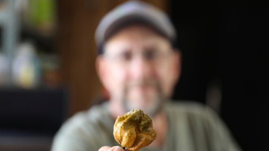 Ed Currie holds up one of his Pepper X chillies, the hottest in the world.