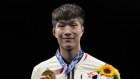Cheung Ka-Long with his gold medal at the award ceremony.