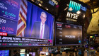 A television broadcasts Jerome Powell, chairman of the U.S. Federal Reserve.