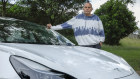 Cameron Walker with a Tesla.