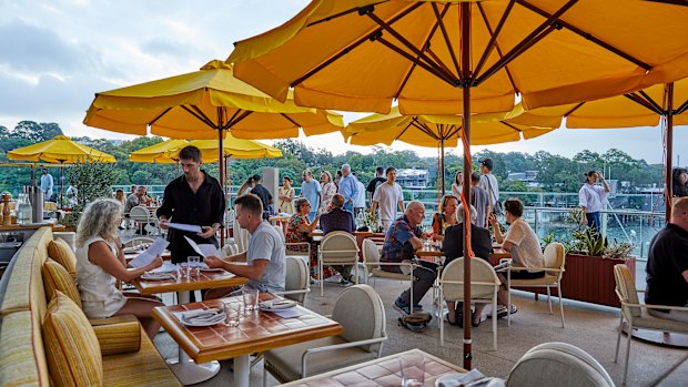 Terrace seating looks over the CBD, Pyrmont and tree-lined Glebe.