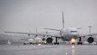 Delayed aircraft line up to take off at Sydney Airport on Tuesday.