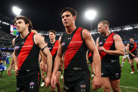 Dejected Essendon players after the club’s loss to Geelong.