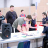 Athletes signing on and registering for a Sports Draft camp. 