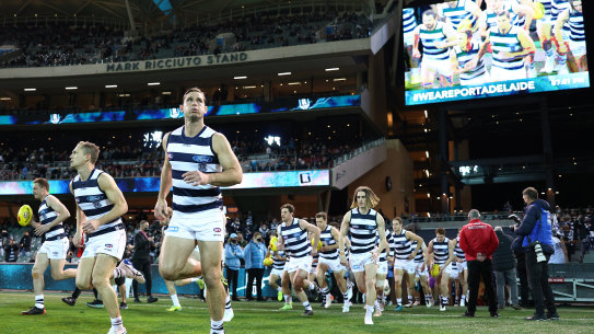 The Cats run out on to Adelaide Oval, one of the venues on standby for the AFL grand final.