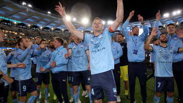 Sydney FC celebrate winning the A-League title on Sunday night. 