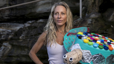 Ocean Lovers Festival Founder Anita Kolni with the sculpture Terri the Turtle, which was made by year 1 students at South Coogee Public School.