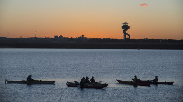 Kayakers enjoy a break at the mouth of the Cooks River at Botany Bay.