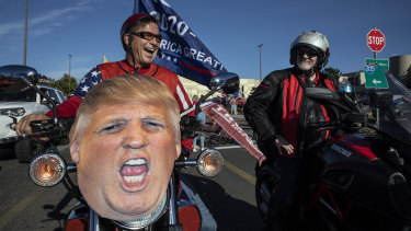 Supporters of President Donald Trump take part in the rally and car parade from Clackamas to Portland that ended in clashes with Black Lives Matter activists.