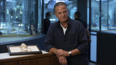Isaac Levy, owner of Israeli jewellery company Yvel, next to parts of the gold mask.
