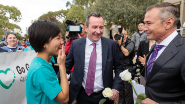 Belinda Teh is greeted by Premier Mark McGowan and Health Minister Roger Cook outside WA Parliament House. The 27-year-old Perth woman embarked on a 4500km journey from Melbourne to Perth after watching her mother die from breast cancer in 2016.