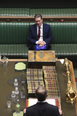 Sir Keir Starmer, seated, and Foreign Secretary Dominic Raab in Parliament on Wednesday.