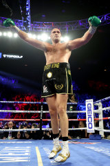 Tyson Fury celebrates after knocking down Deontay Wilder in Las Vegas.