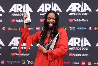 Genesis Owusu poses with his four ARIA Awards.