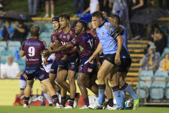 Jordan Petaia celebrates a try  for the Reds against NSW at Leichhardt Oval,