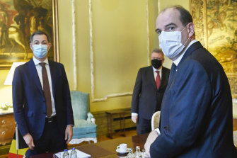 French Prime Minister Jean Castex, right, and Prime Minister Alexander De Croo of Belgium, left, are seen at the start of a Belgian-French security consultation meeting at Egmont Palace in Brussels on Monday.