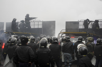 Riot police blocked a street during the riots on Thursday. 