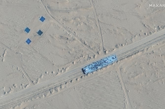 A satellite image shows what appears to be a mock-up of a US Navy vessel in Ruoqiang county, China.