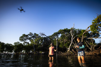 Using a drone to capture aerial images of the islands. 