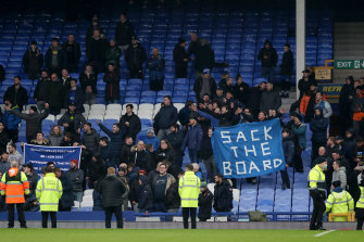 Everton fans unveil a banner in the crowd, directed at the board after their sides defeat during the Premier League match against Aston Villa.