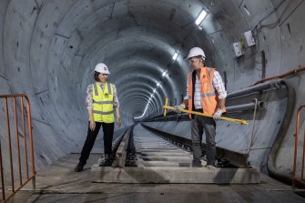 NSW Premier Gladys Berejiklian and Transport Minister Andrew Constance help lay the first tracks on the Metro City and Southwest project.