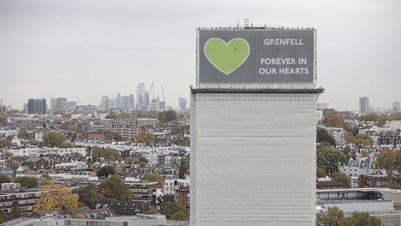A general view of what remains of Grenfell Tower covered with hoardings following a severe fire in June 2017 in London, England. 